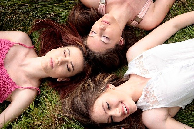 women lying in the ground 
