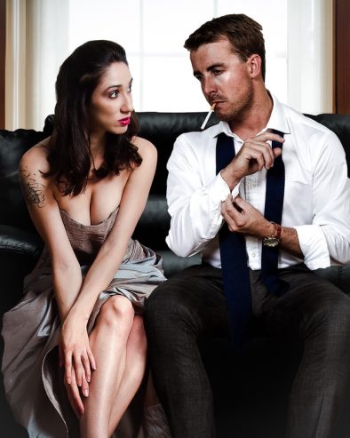 man sitting on a sofa with a woman 