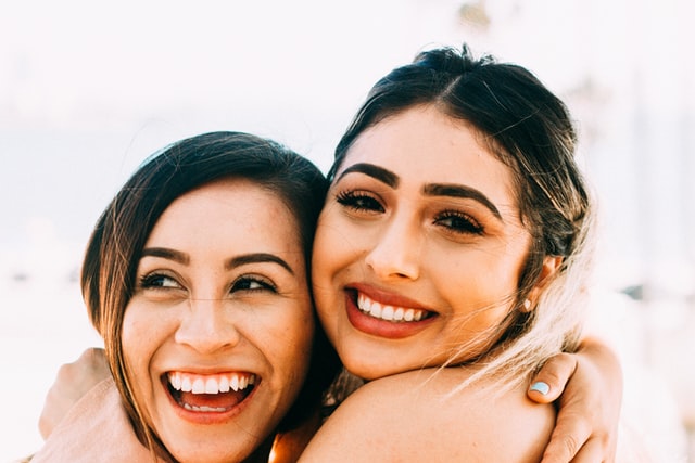 two women smiling 