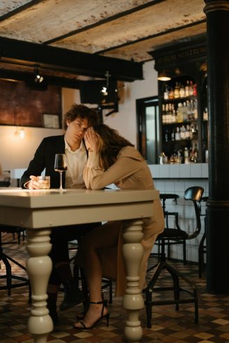 man and woman arguing in a restaurant 