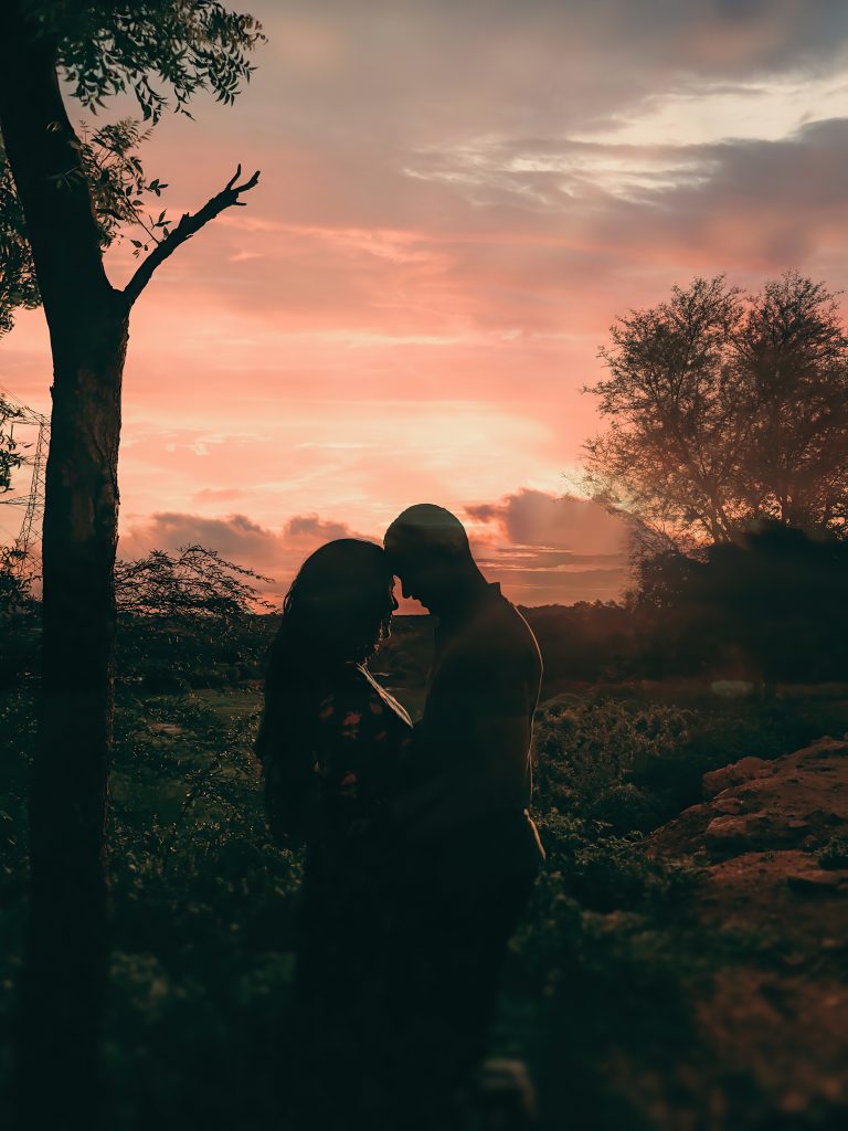 romantic couple enjoying sunset