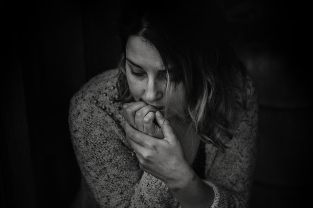 woman biting her fingers 
