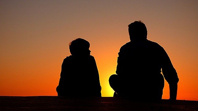 silhouette of father and son during sundown